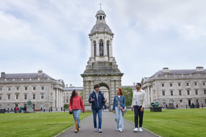 a group of people standing in front of a building